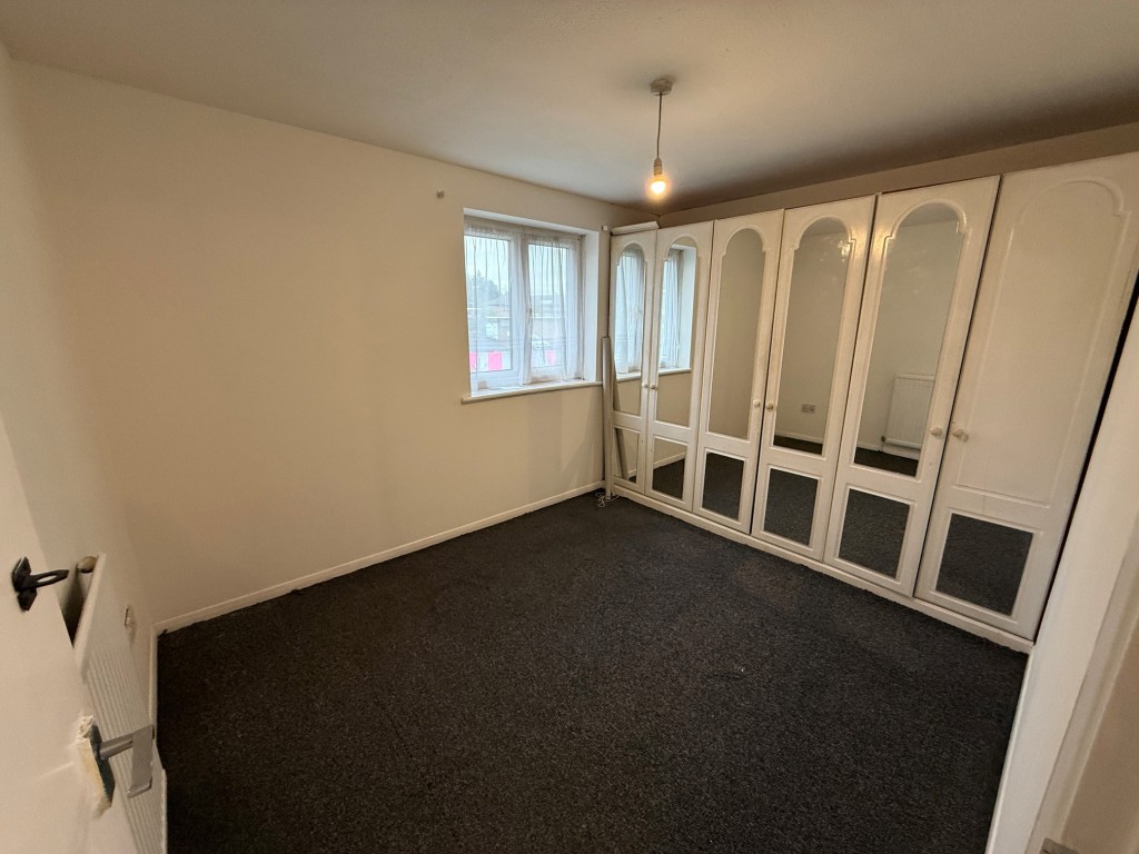 Lot: 158 - HOUSE FOR IMPROVEMENT - Bedroom one with fitted wardrobes